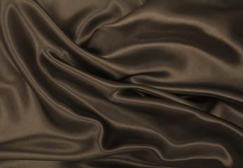 Smooth elegant brown silk or satin texture as abstract background. Luxurious background design. In Sepia toned. Retro style