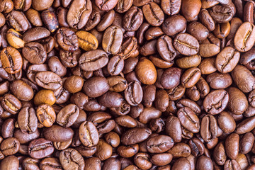 Fried coffee beans texture close-up