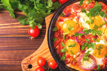 Shakshuka. Traditional Israeli cuisine. Fried eggs with vegetables