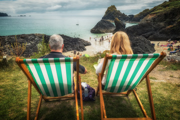 Deck chairs at nuance cove with a couple