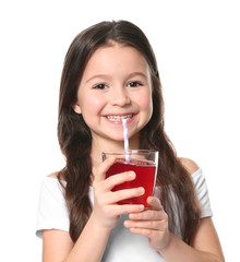 Cute little girl with glass of juice on white background © Africa Studio