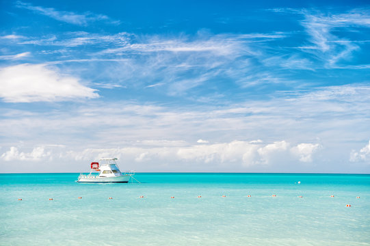 Fototapeta marine of Antigua St. Johns with boat on blue water