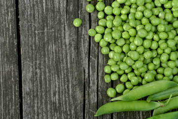 Green peas on a wooden table