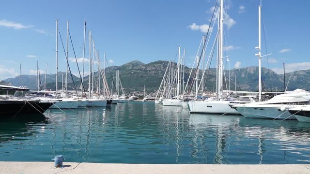Seaside promenade in Budva, Montenegro, view of marina with boats and yachts