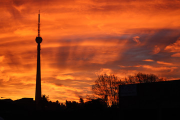 Naklejka premium communication tower silhouette in johannesburg at sunset