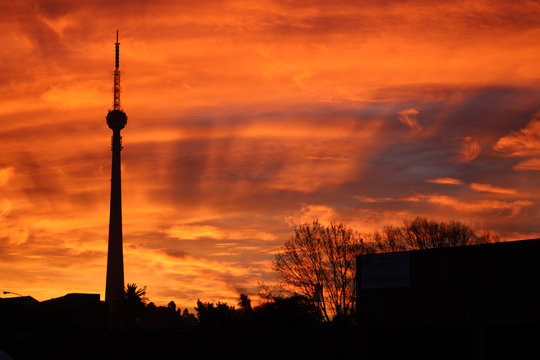 communication tower silhouette in johannesburg at sunset