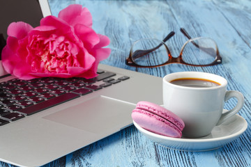 Spring summer set with laptop, red flowers peonies on rough wooden background