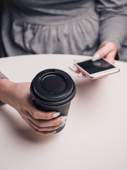 Coffee to go and smartphone