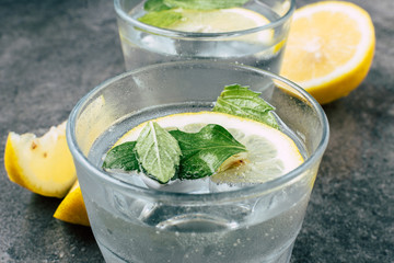 Glass of water on stone background