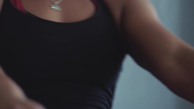 Closeup of intense female athlete rowing