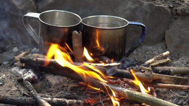 two cups in bonfire