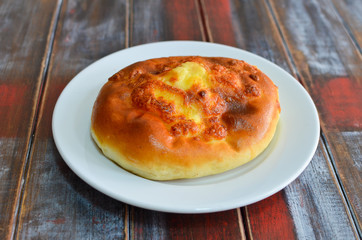 Traditional georgian food khachapuri on wooden painted background