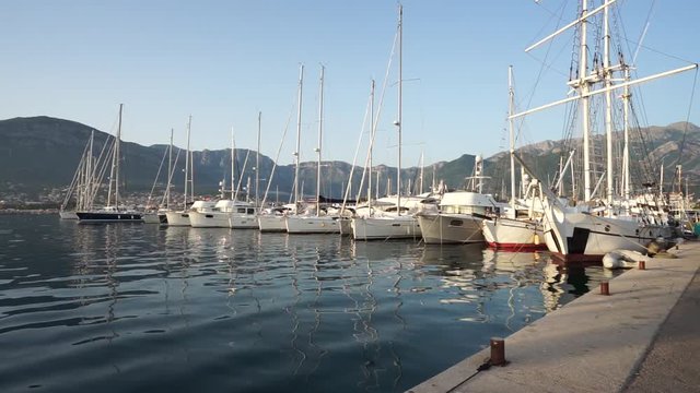 Seaside promenade in Budva, Montenegro, view of marina with boats and yachts