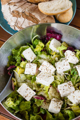 Delicious greek salad steak with cheese and bread