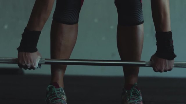 4k Cinematic Close up of a Female doing a deadlift