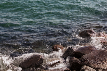 lakeshore tide among the rocks