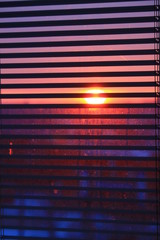 sunset looking through jalousie