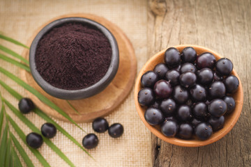 Fruits and acai powder originating from the Amazon  (Euterpe oleracea)