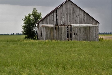 Old grey barn in rural countryside