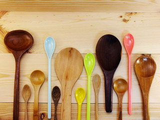 collection of wooden spoon and ladles on wooden table
