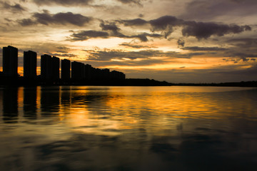 city scape at night with reflection on lake. Thailand. sunset with sky. small lake in city.