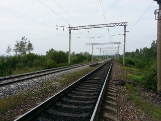 Fototapeta na wymiar Railway, rails, perspective, electricity, trees, summer, sky, blue, wires, rails, techno,