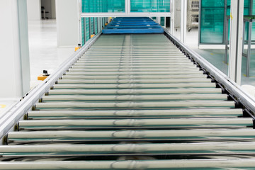The conveyor chain, and conveyor belt is on production line in clean room.