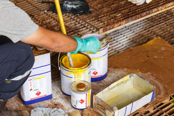 Workers are preparing paint to spray paint, to prevent corrosion to corrode material, to prolong the life of the material for a long time in sae offshore.