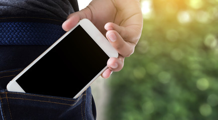 Young handsome poses hand Mobile Phone Pocket Communication Copy Space
