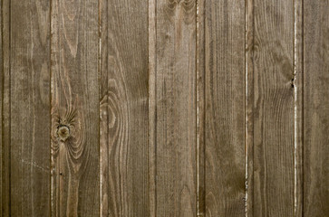 Wood plank texture vertically. Wooden floor or wall. Brown color.