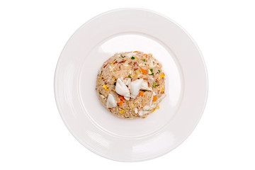 Tasty Thai cuisine, crab meat fried rice beautiful serving in white plate isolated on white background.