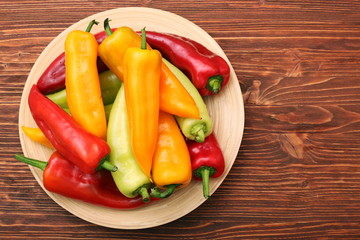 Fresh colored sweet peppers on the plate
