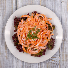 Salad with fresh carrots with sour cream