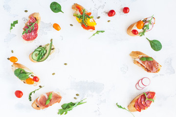 Traditional spanish tapas on white table. Brushetta set. Flat lay, top view, copy space