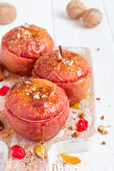 Red baked apples with cinnamon, walnuts and honey. Healthy Diet Dessert.