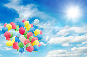 Fototapeta na wymiar Happiness, summer, wedding, birthday, honeymoon party: Multicolor ballons, blue sky, clouds and sun :)