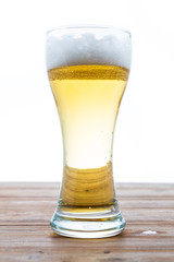 beer in a glass on white background