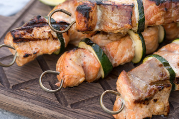 Delicious grilled salmon kebab with a zucchini