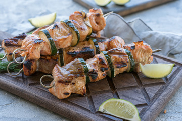 Delicious grilled salmon kebab with a zucchini