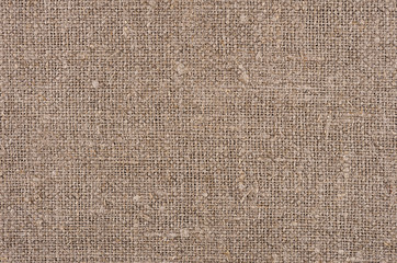 Brown natural canvas rough rustic fabric texture.