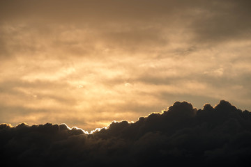  Sunset against the background of the evening sky with colorful shades of flowers on the clouds