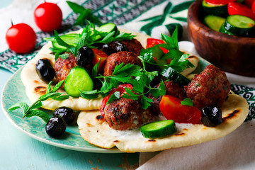 Greek meatbolls keftedes with pita and tzatziki