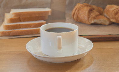 coffee and bread in the morning on food table
