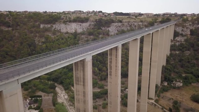 flying alongside roadway of Modica viaduct