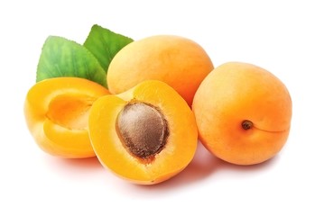 Sweet apricots with leafs .