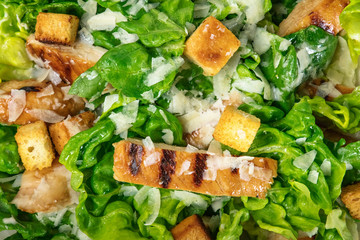 Closeup of chicken Caesar salad, overhead shot