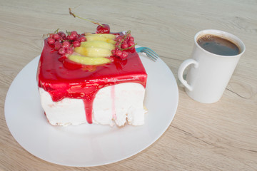 Cake with fresh red currant on the plate, closeup. Close up cake with red currant