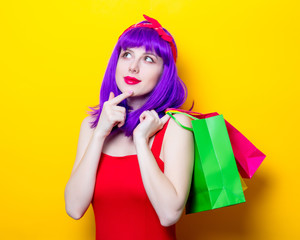 girl with purple color hair and shopping bags