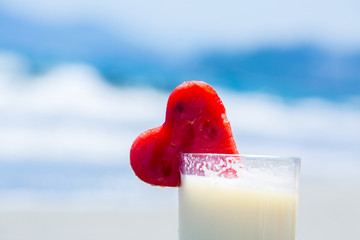 Summer cocktail pinacolada with watermelon on the beach