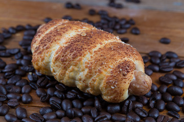 sausage dough and coffee beans on wooden table